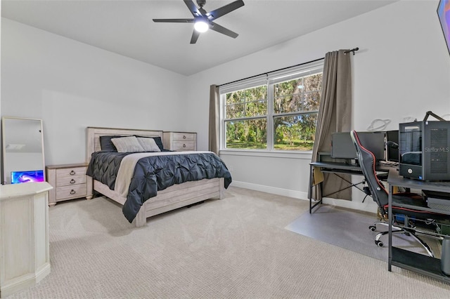 bedroom featuring ceiling fan and light carpet