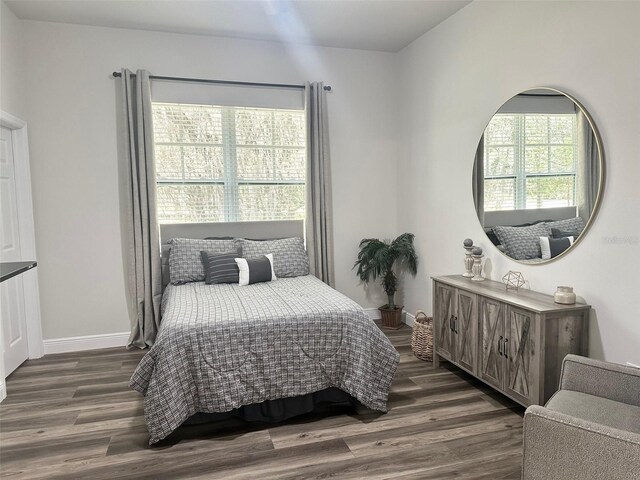 4586 Hickory Oak Dr, Brooksville, FL 34601 - bedroom with dark wood-style floors and baseboards