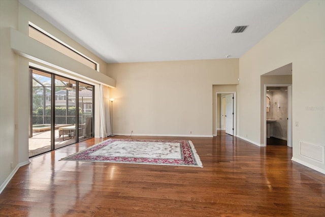 spare room featuring dark wood-type flooring