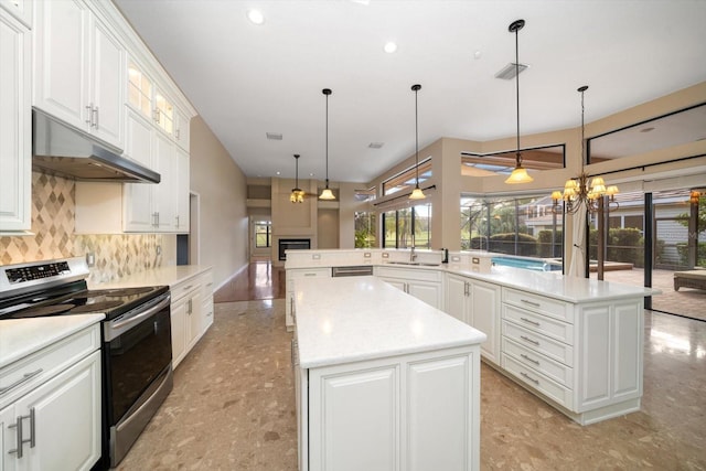 kitchen with a kitchen island, hanging light fixtures, stainless steel electric range oven, and kitchen peninsula