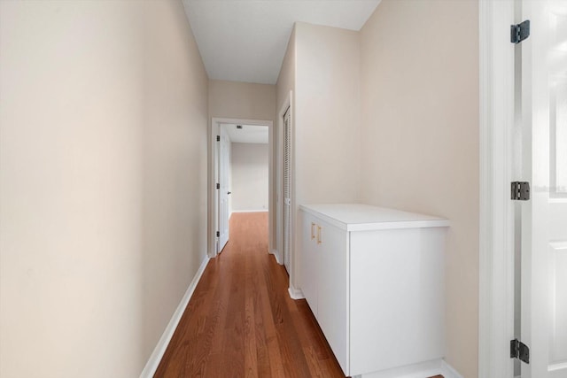 hallway featuring dark hardwood / wood-style flooring