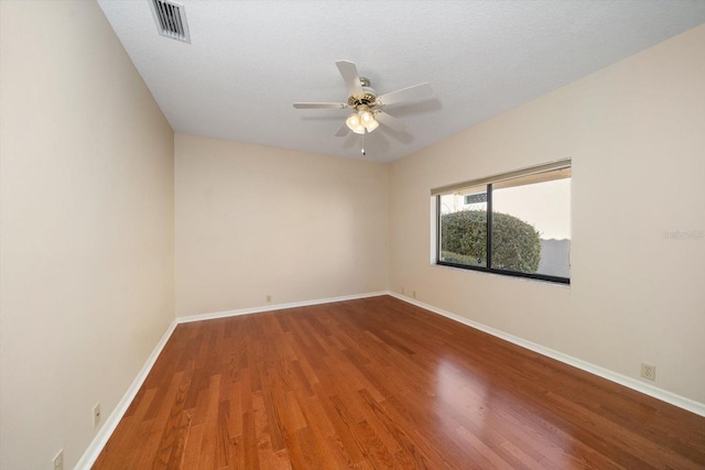 unfurnished room with hardwood / wood-style floors, a textured ceiling, and ceiling fan