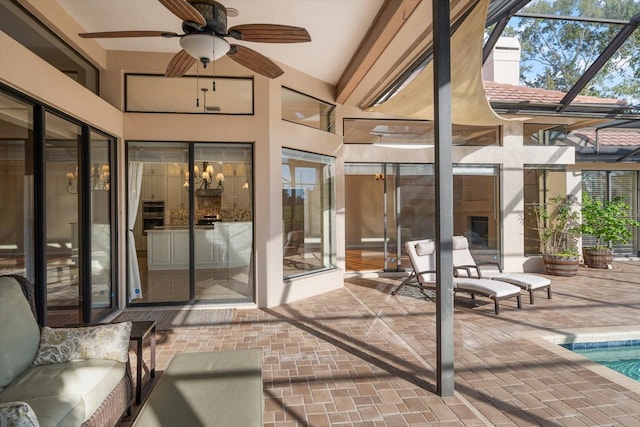 sunroom featuring vaulted ceiling, a swimming pool, and ceiling fan