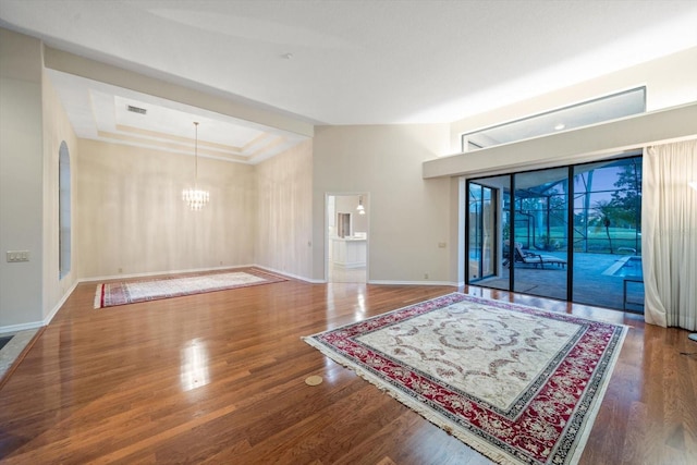 living room featuring a notable chandelier and hardwood / wood-style floors