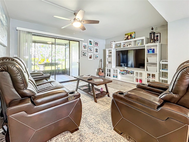 living room featuring ceiling fan and light wood-type flooring