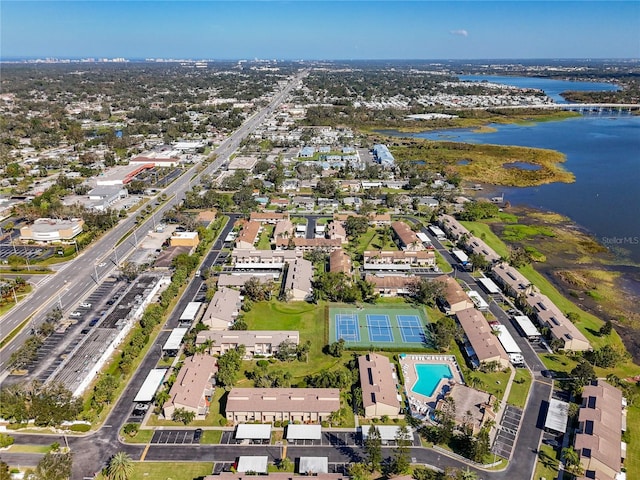 birds eye view of property with a water view