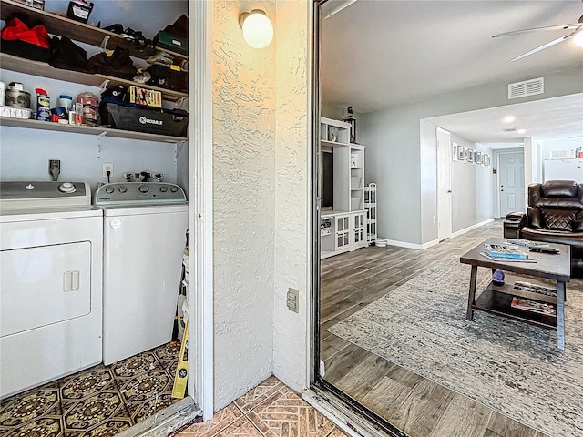 laundry room with separate washer and dryer, ceiling fan, and hardwood / wood-style flooring