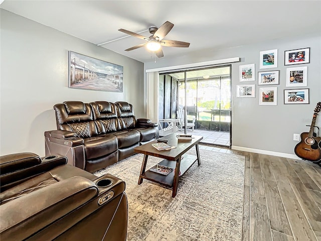 living room with hardwood / wood-style flooring and ceiling fan