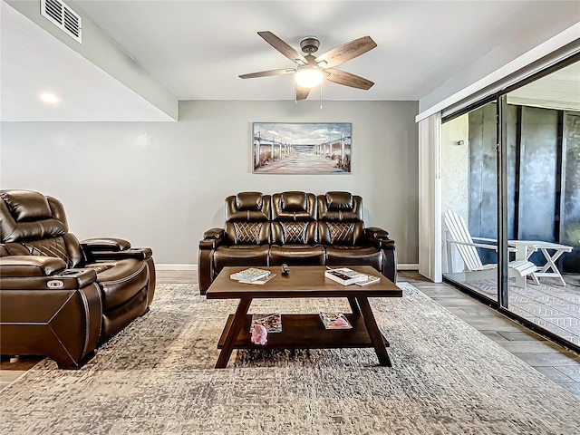 living room with hardwood / wood-style flooring and ceiling fan