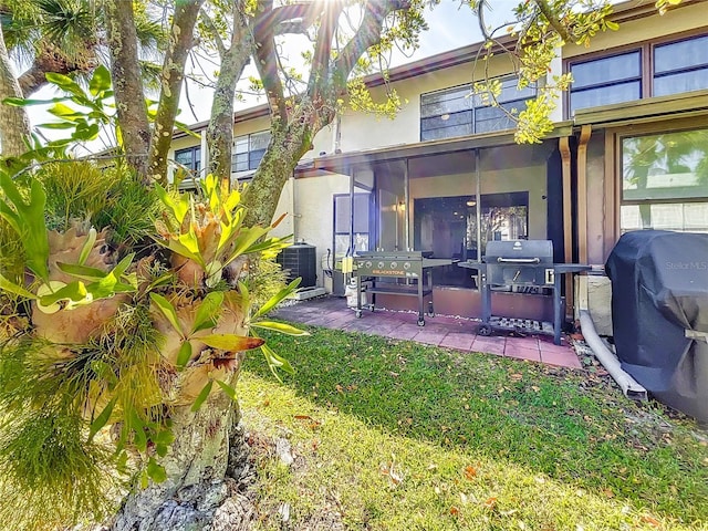 view of yard featuring a sunroom and cooling unit