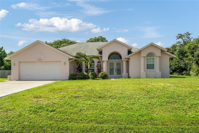 single story home with a front yard and a garage