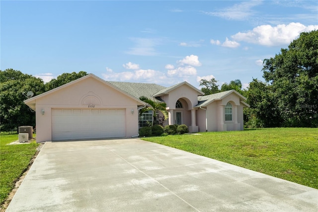 ranch-style home with a front yard and a garage