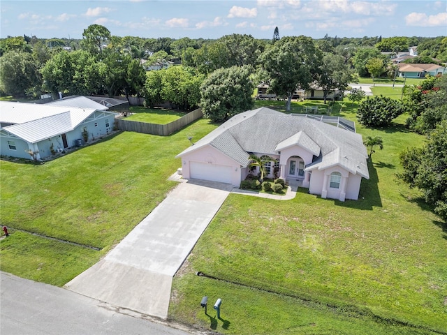 2152 SE Harding St, Port Saint Lucie, FL 34952 - aerial view of property and surrounding area with a tree filled landscape