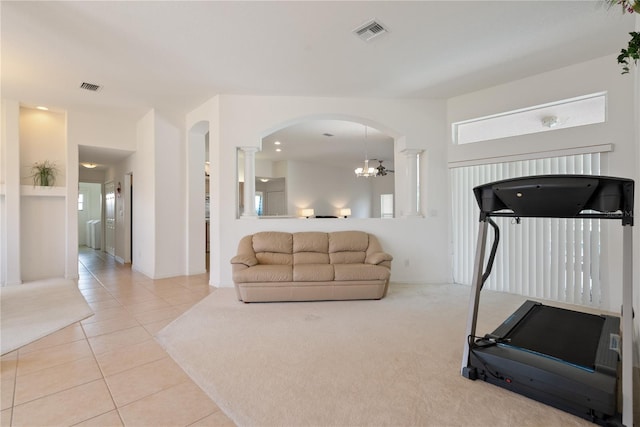 2152 SE Harding St, Port Saint Lucie, FL 34952 - exercise area with arched walkways, light tile patterned flooring, and a chandelier