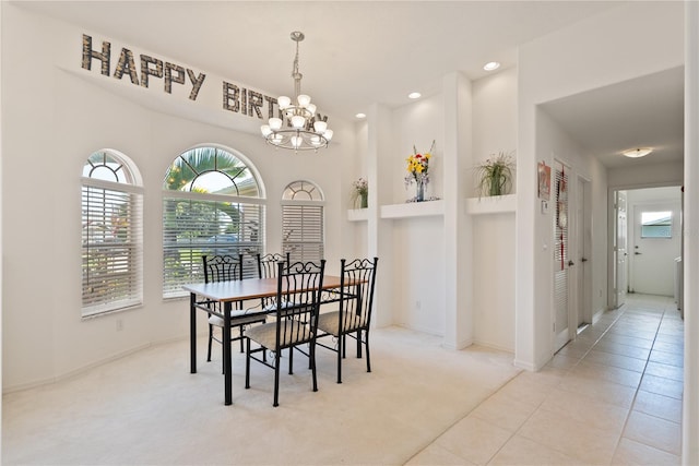 2152 SE Harding St, Port Saint Lucie, FL 34952 - carpeted dining area with recessed lighting, a chandelier, baseboards, and tile patterned flooring