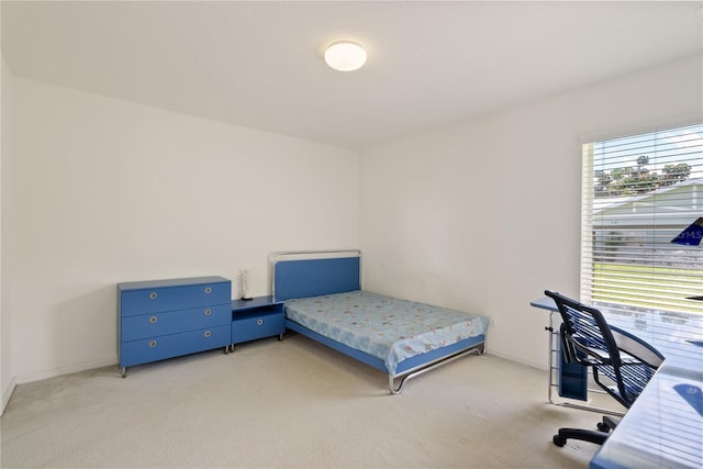2152 SE Harding St, Port Saint Lucie, FL 34952 - bedroom featuring multiple windows and light colored carpet