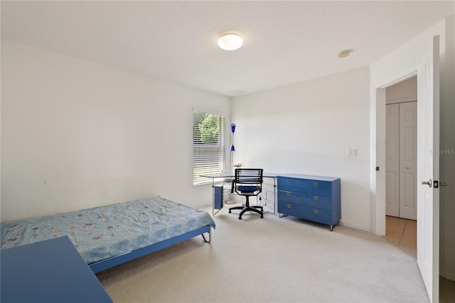 bedroom with light carpet