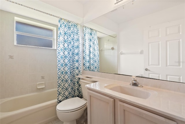 full bathroom with vanity, shower / tub combo with curtain, and toilet