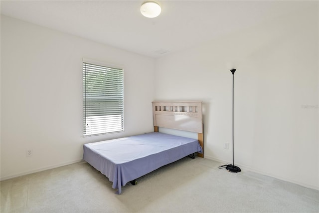 bedroom with light carpet