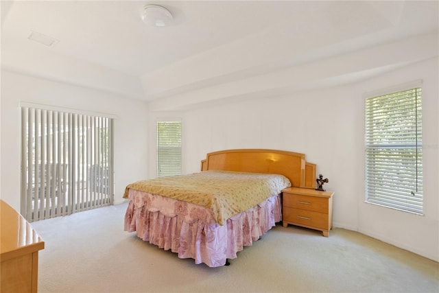 2152 SE Harding St, Port Saint Lucie, FL 34952 - bedroom featuring light carpet and access to exterior