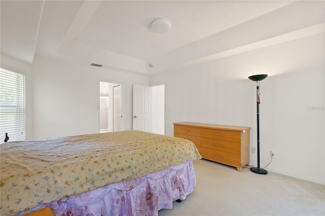 bedroom featuring light carpet