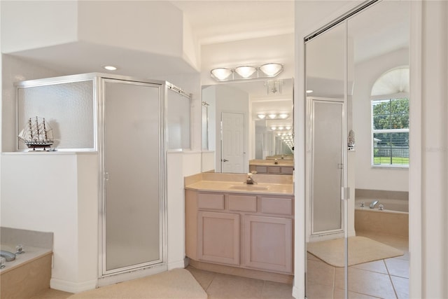 bathroom with vanity, separate shower and tub, and tile patterned flooring