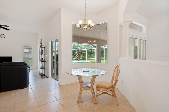 tiled dining room with ornate columns and ceiling fan