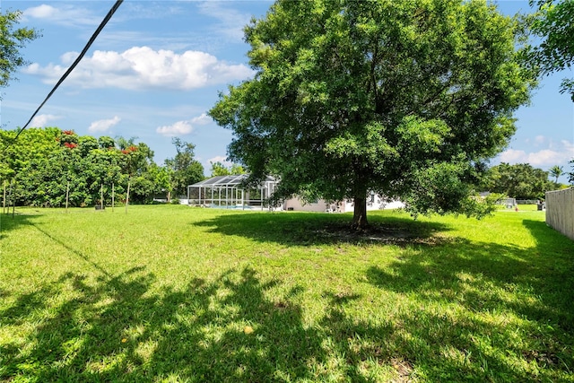 view of yard with a lanai