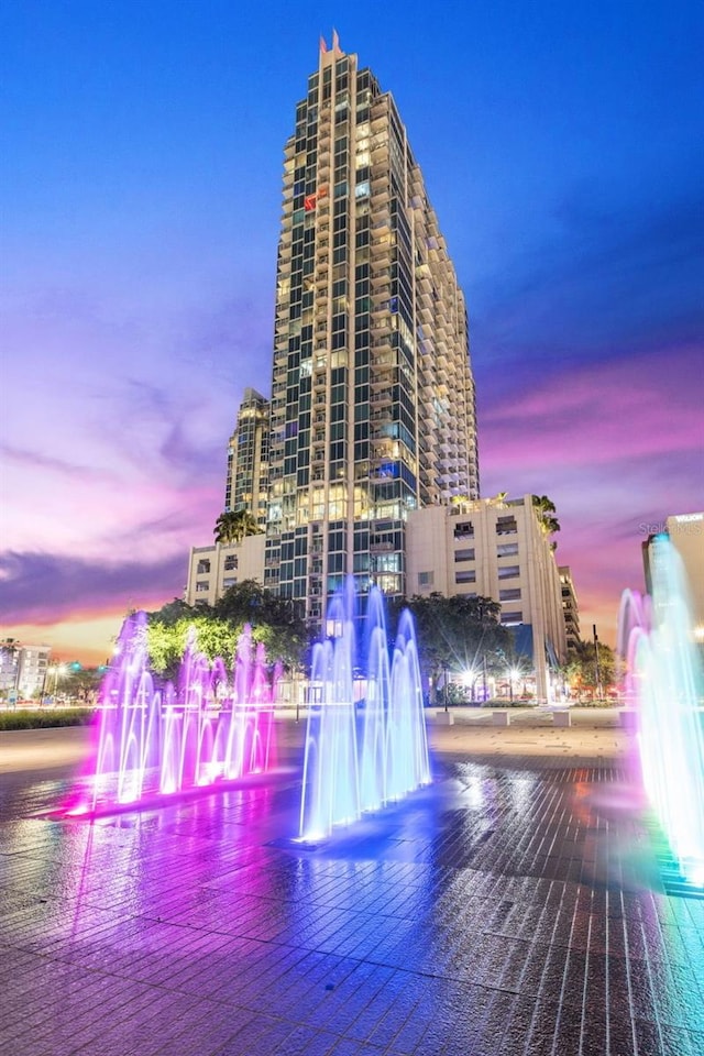 outdoor building at dusk featuring a water view