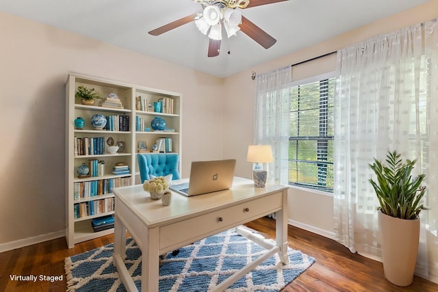 office area featuring dark hardwood / wood-style floors and ceiling fan