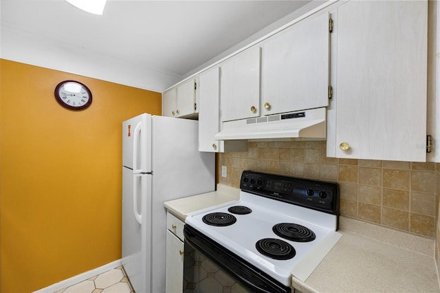 kitchen featuring backsplash, electric range, and white cabinets