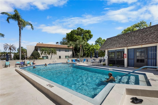 view of pool featuring a patio