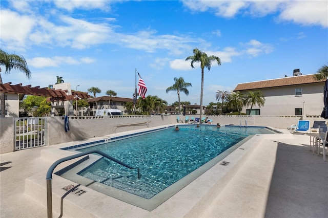 view of swimming pool with a patio