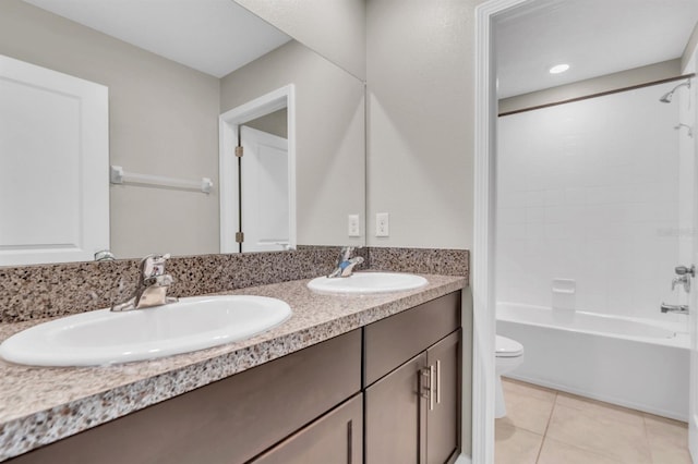 full bathroom with toilet, vanity, tile patterned floors, and shower / bath combination