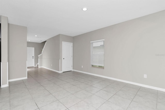 empty room featuring light tile patterned floors