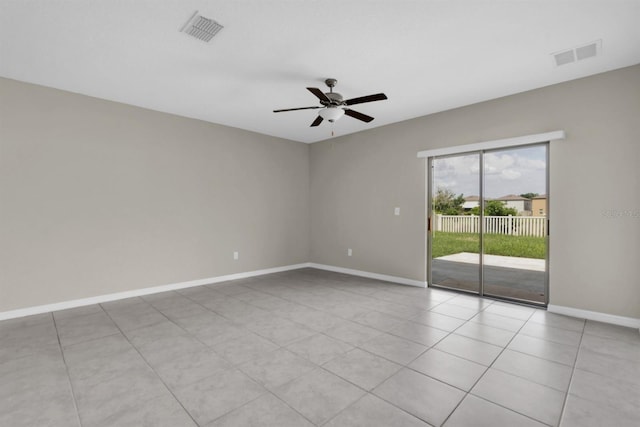 empty room featuring ceiling fan and light tile patterned floors