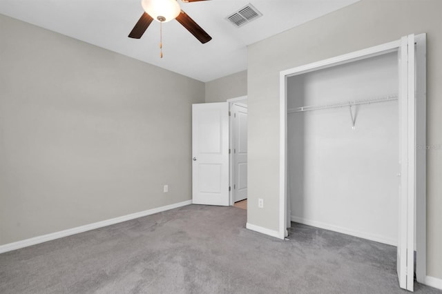 unfurnished bedroom with light carpet, a closet, and ceiling fan