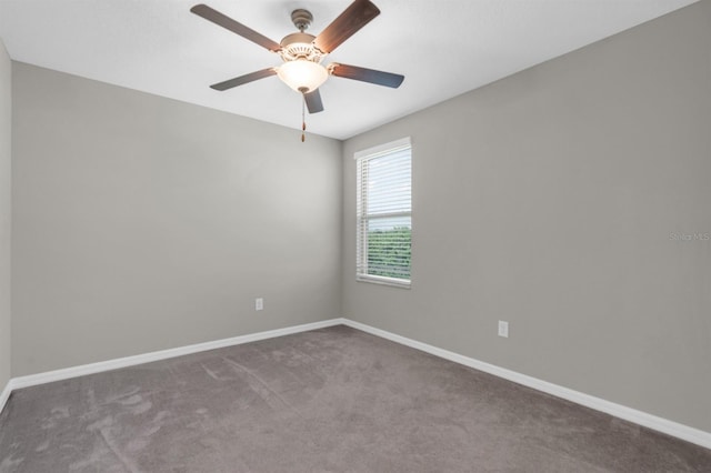 spare room with carpet and ceiling fan