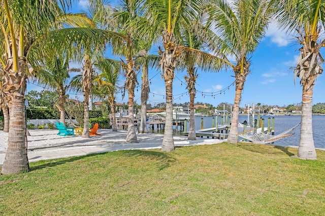 exterior space featuring a yard and a water view