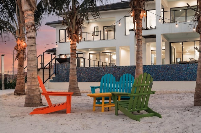 patio terrace at dusk with a balcony