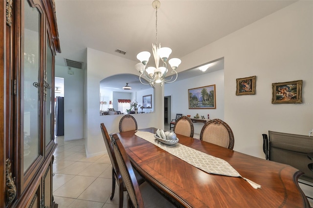 dining space featuring a chandelier and light tile patterned floors