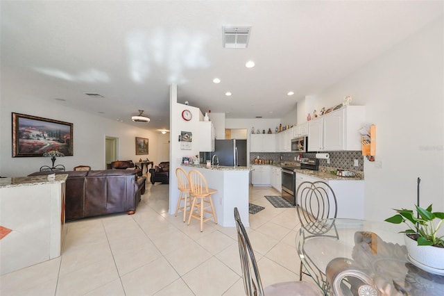 tiled dining room with sink