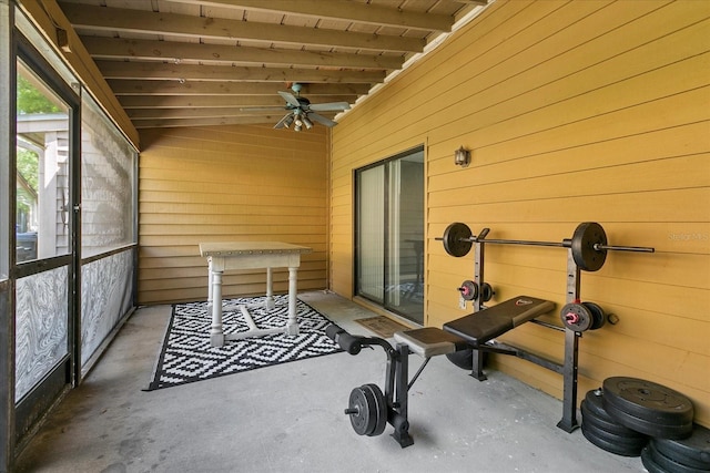 unfurnished sunroom featuring ceiling fan