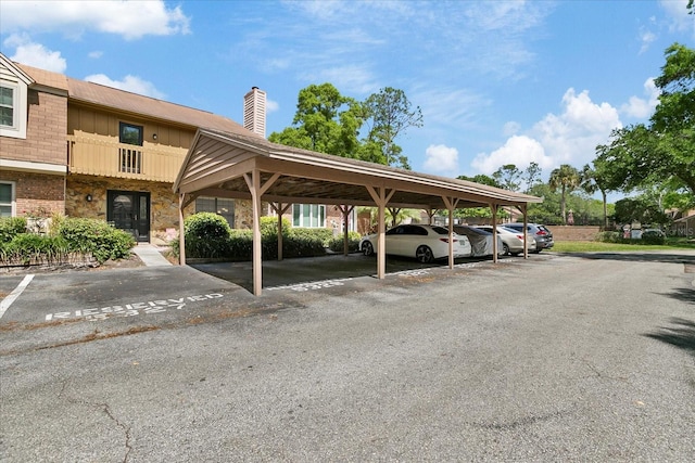 view of partially covered parking lot