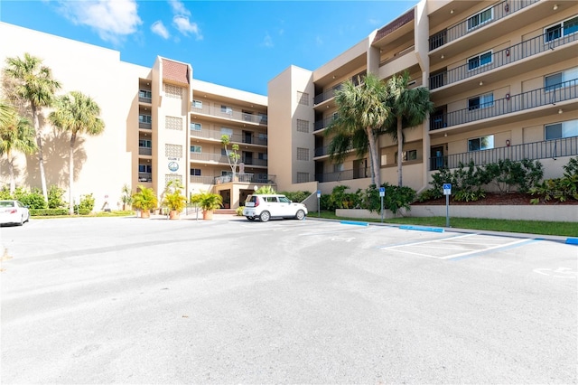 90 S Highland Ave Unit 1115, Tarpon Springs, FL 34689 - view of property featuring uncovered parking