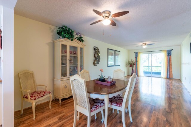 90 S Highland Ave Unit 1115, Tarpon Springs, FL 34689 - dining area with wood finished floors, a ceiling fan, and a textured ceiling