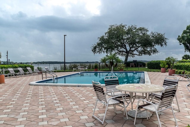 view of swimming pool with a patio