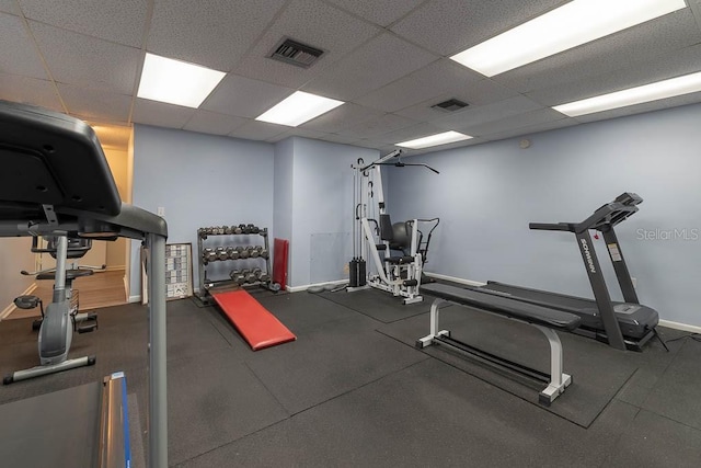 exercise area featuring a drop ceiling