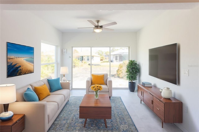 tiled living room featuring ceiling fan