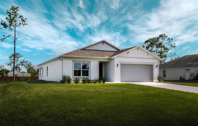 view of front of house featuring a garage and a front lawn